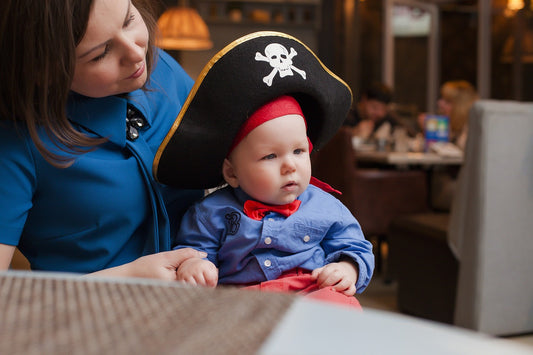 baby wearing a pirate costume