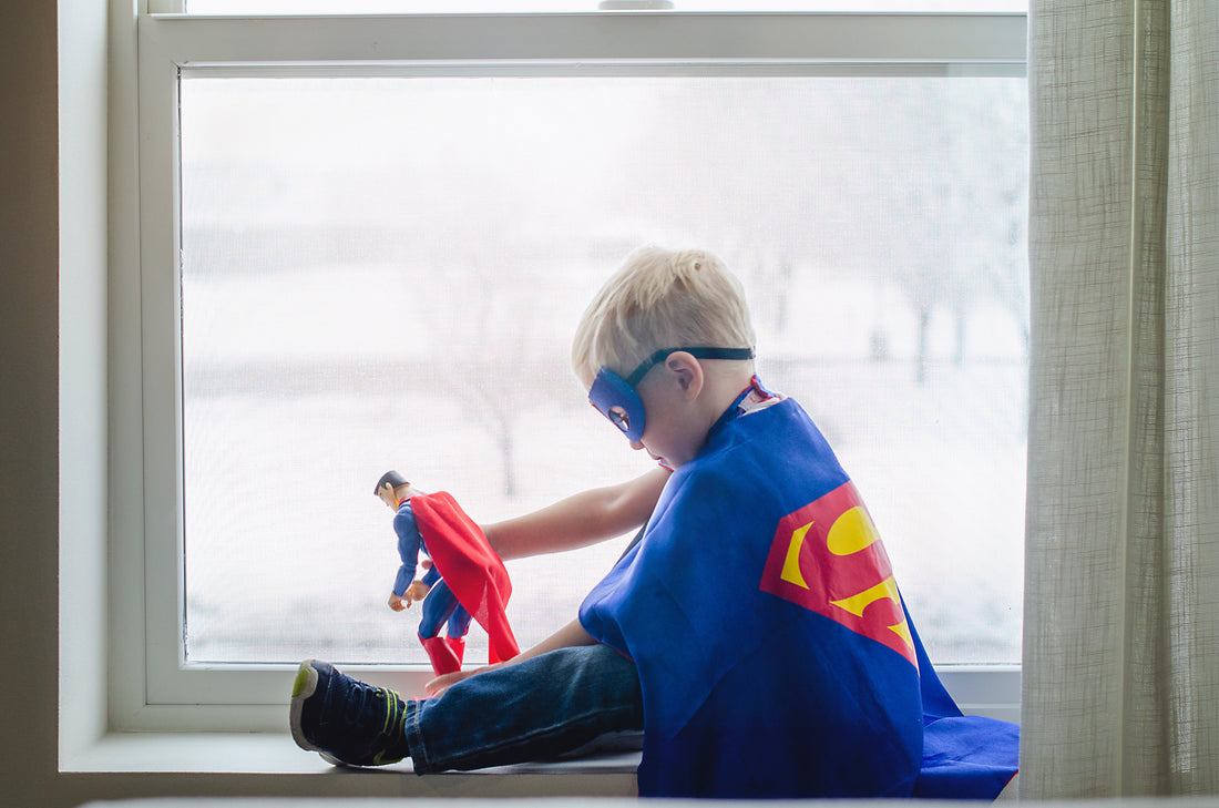 kid wearing a superhero costume