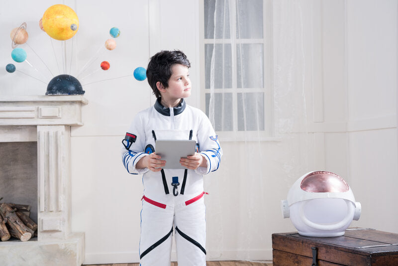 boy wearing an astronaut costume